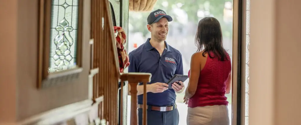 homeowner with bedbugs speaks to excel pest services technician